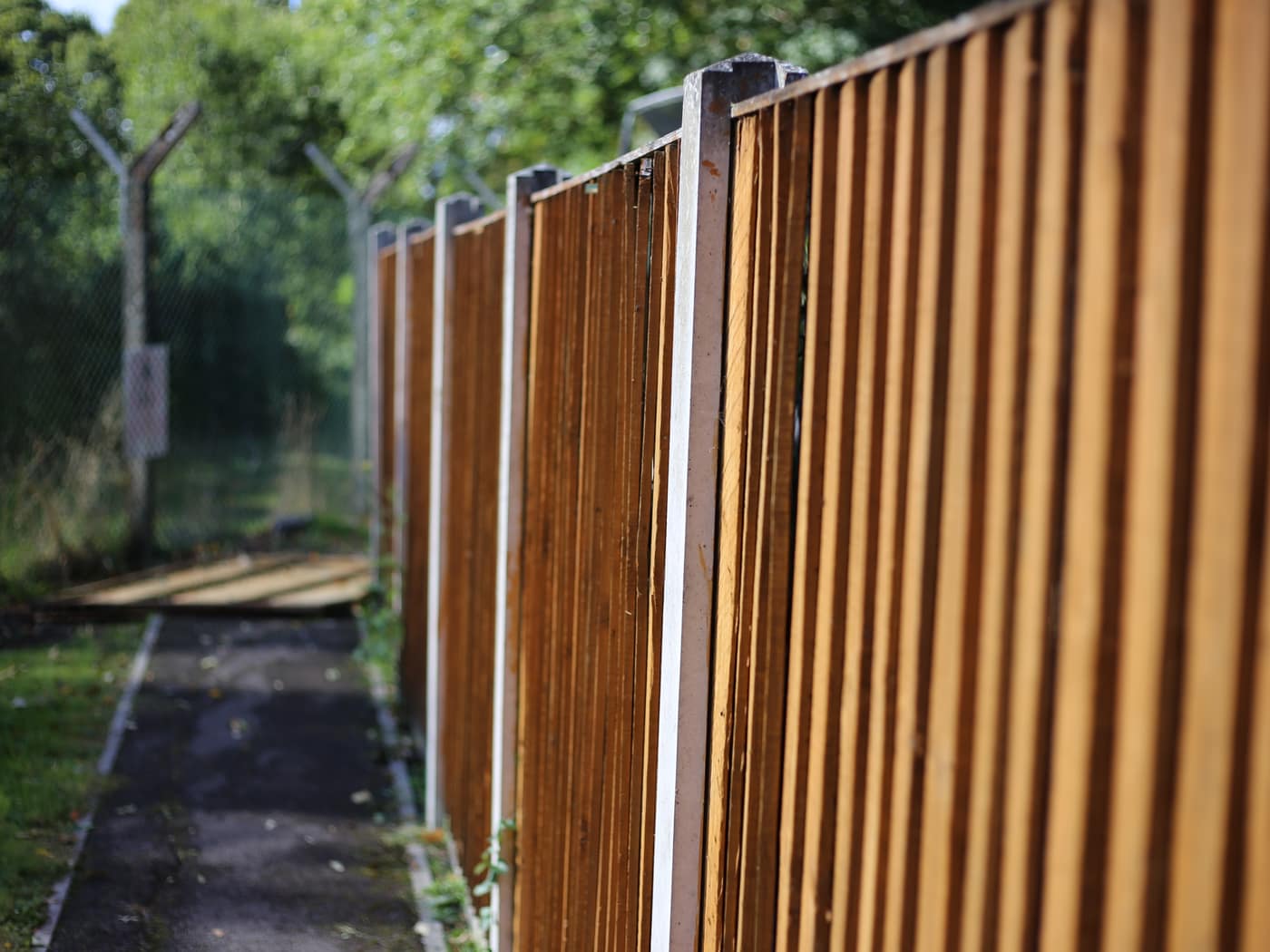Closeboard fence along a path