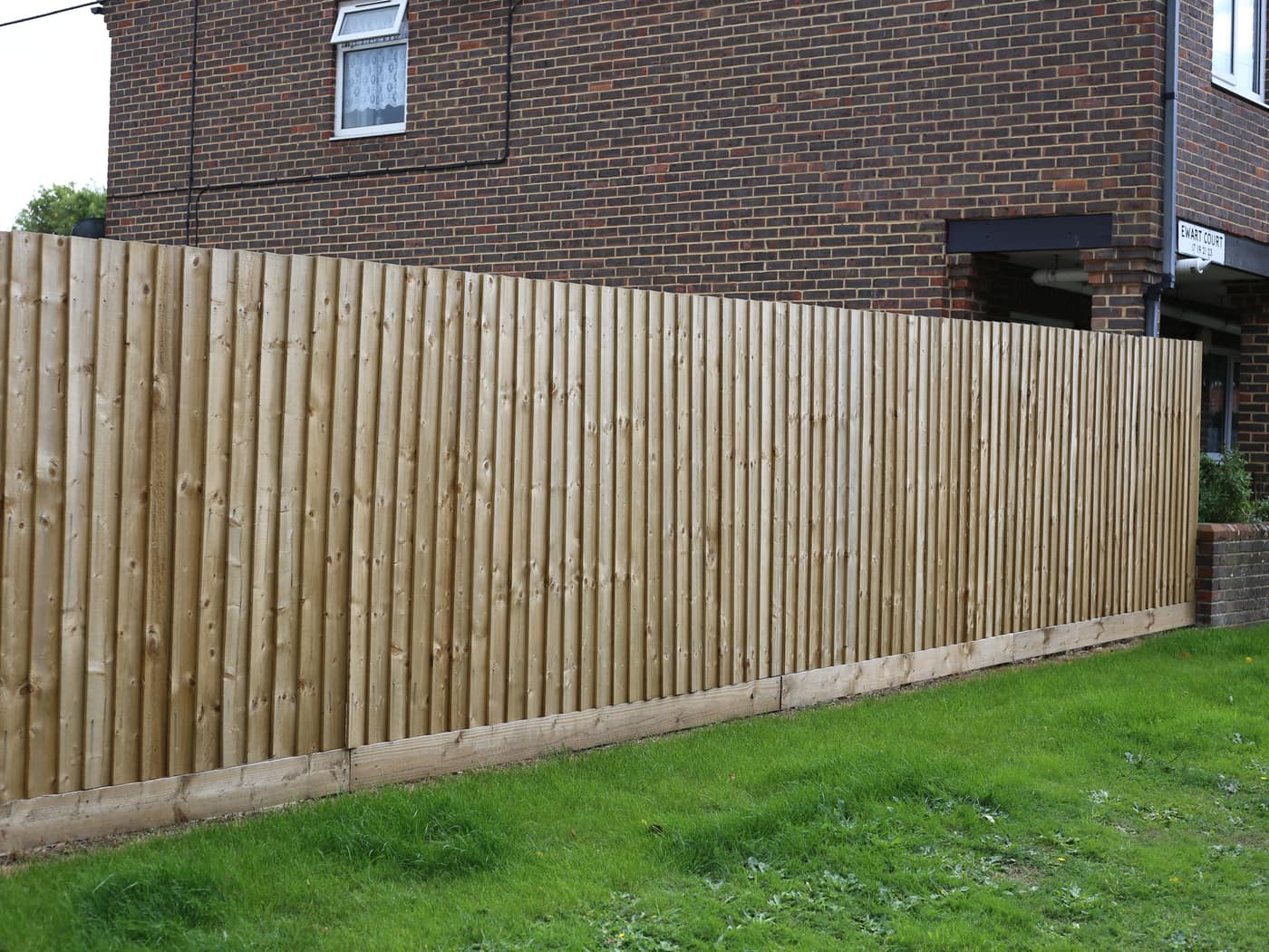 Closeboard fence beside a lawn